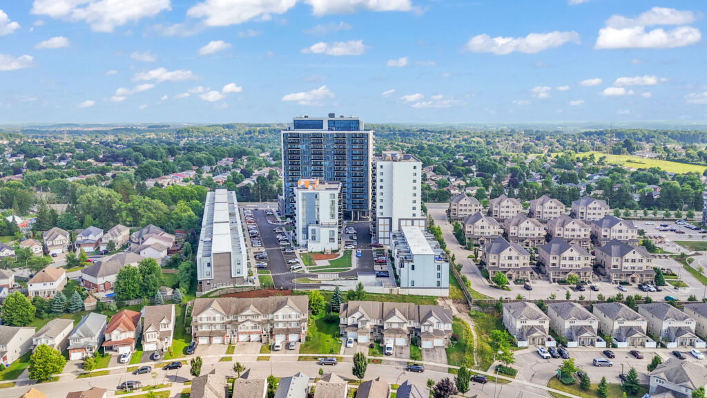 Aerial view of a Toronto residential neighborhood, showcasing houses, streets, and green spaces.