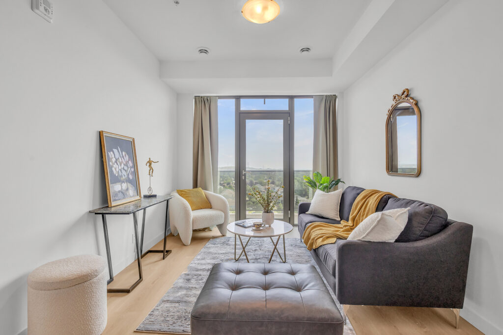 A cozy living room featuring a couch, a chair, and a coffee table.